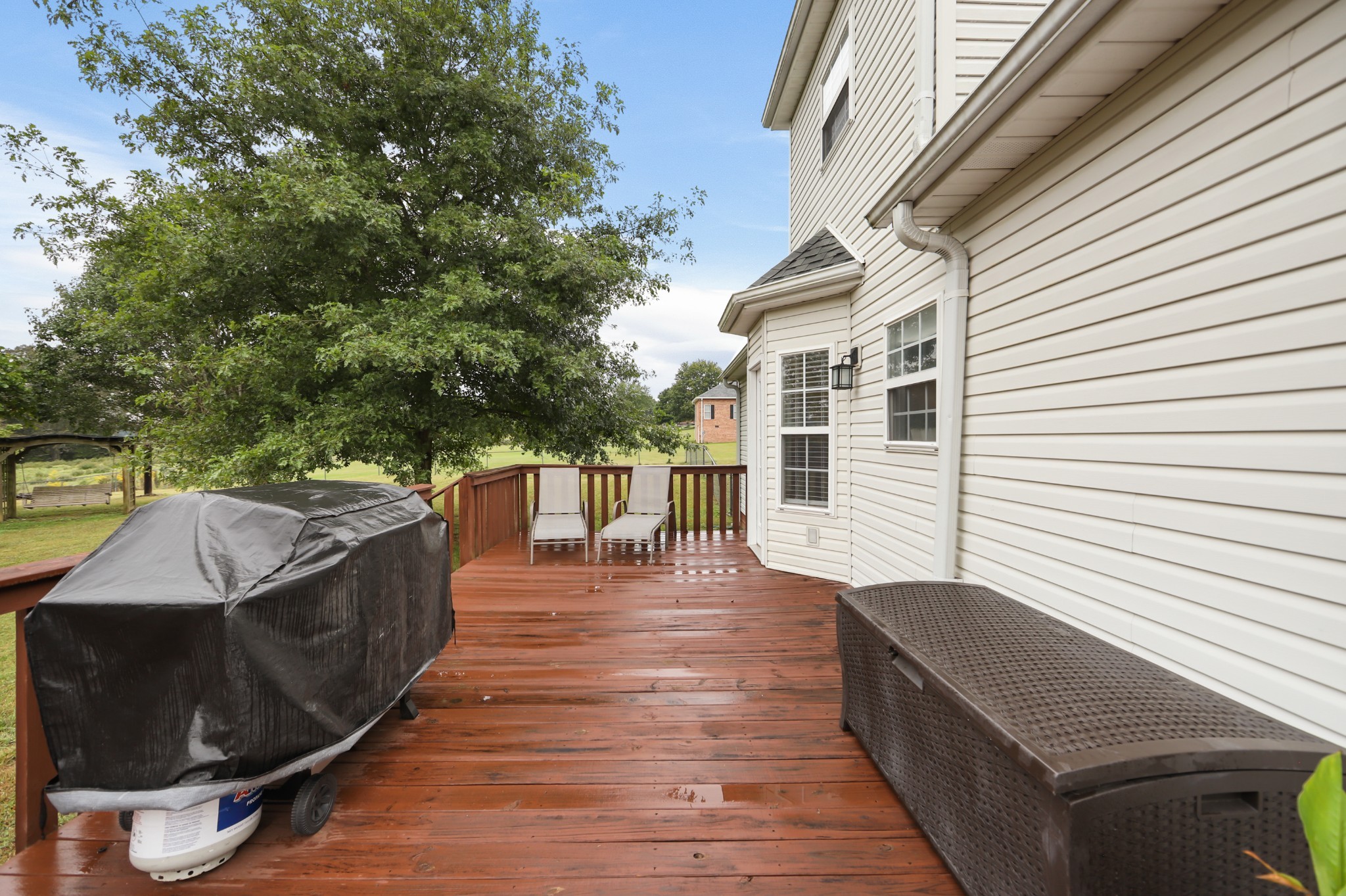 1400 Camp Ravine Road Burns, TN 37029 - Photo 32 of 40 a view of a roof deck with couches and potted plants
