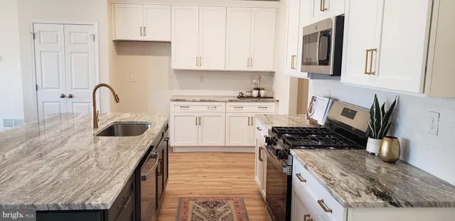 an aerial view of a house outdoor space and street view