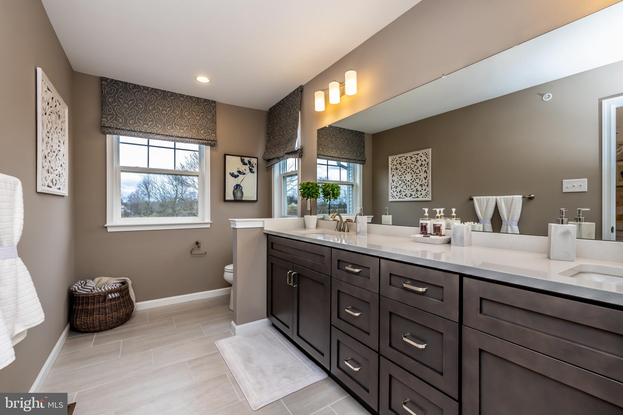5 Tullow Hill Drive Kennett Square, PA 19348 - Photo 13 of 40 a spacious bathroom with double vanity and a mirror