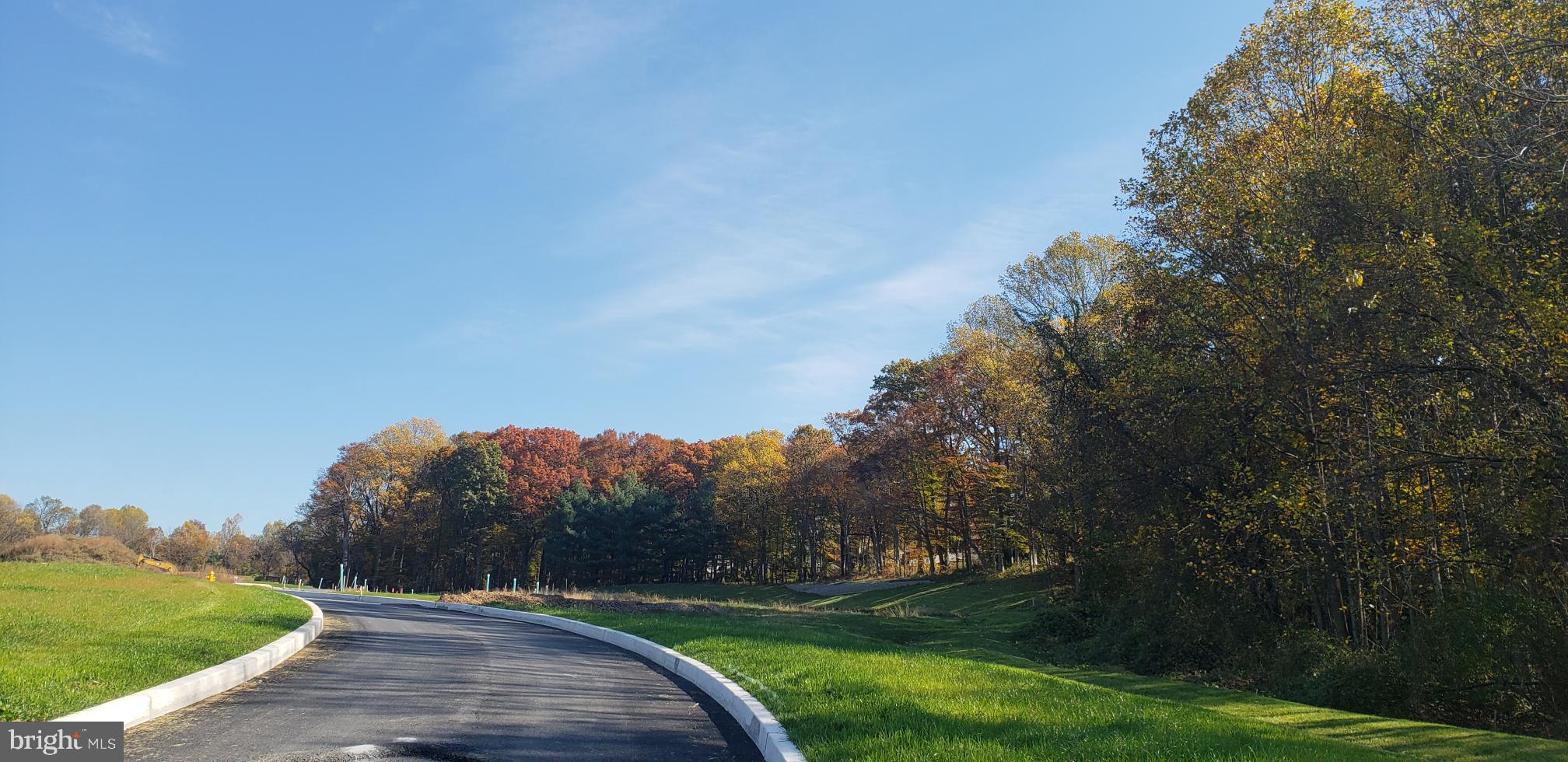 5 Tullow Hill Drive Kennett Square, PA 19348 - Photo 14 of 40 a view of a street with a trees in the background