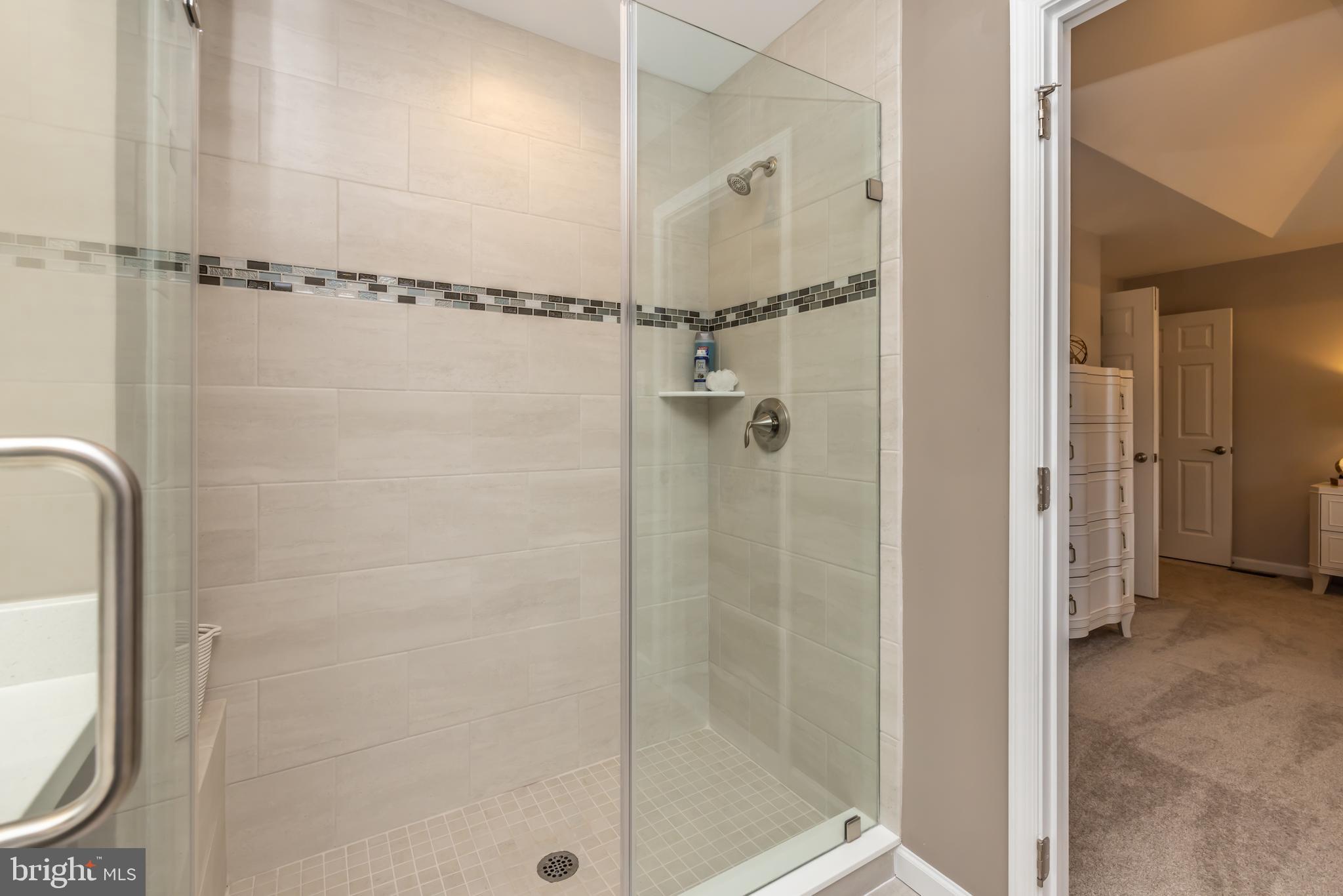 5 Tullow Hill Drive Kennett Square, PA 19348 - Photo 24 of 40 a bathroom with a glass shower door