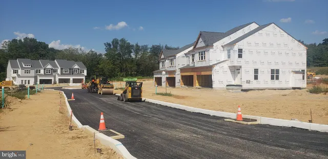 a view of a house with roof and sitting area