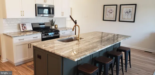 a view of a street with a big yard