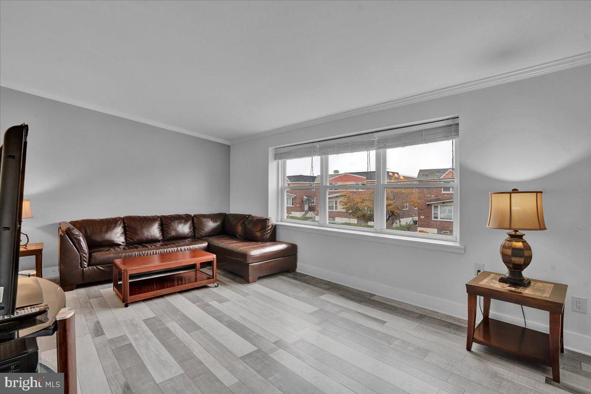 1952 Goodnaw Street, Unit 2 Philadelphia, PA 19115 - Photo 1 of 26 a living room with furniture and a window