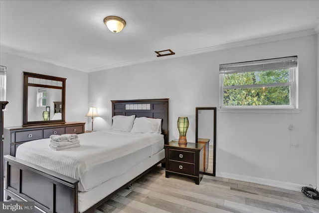 a bedroom with a bed and a dresser