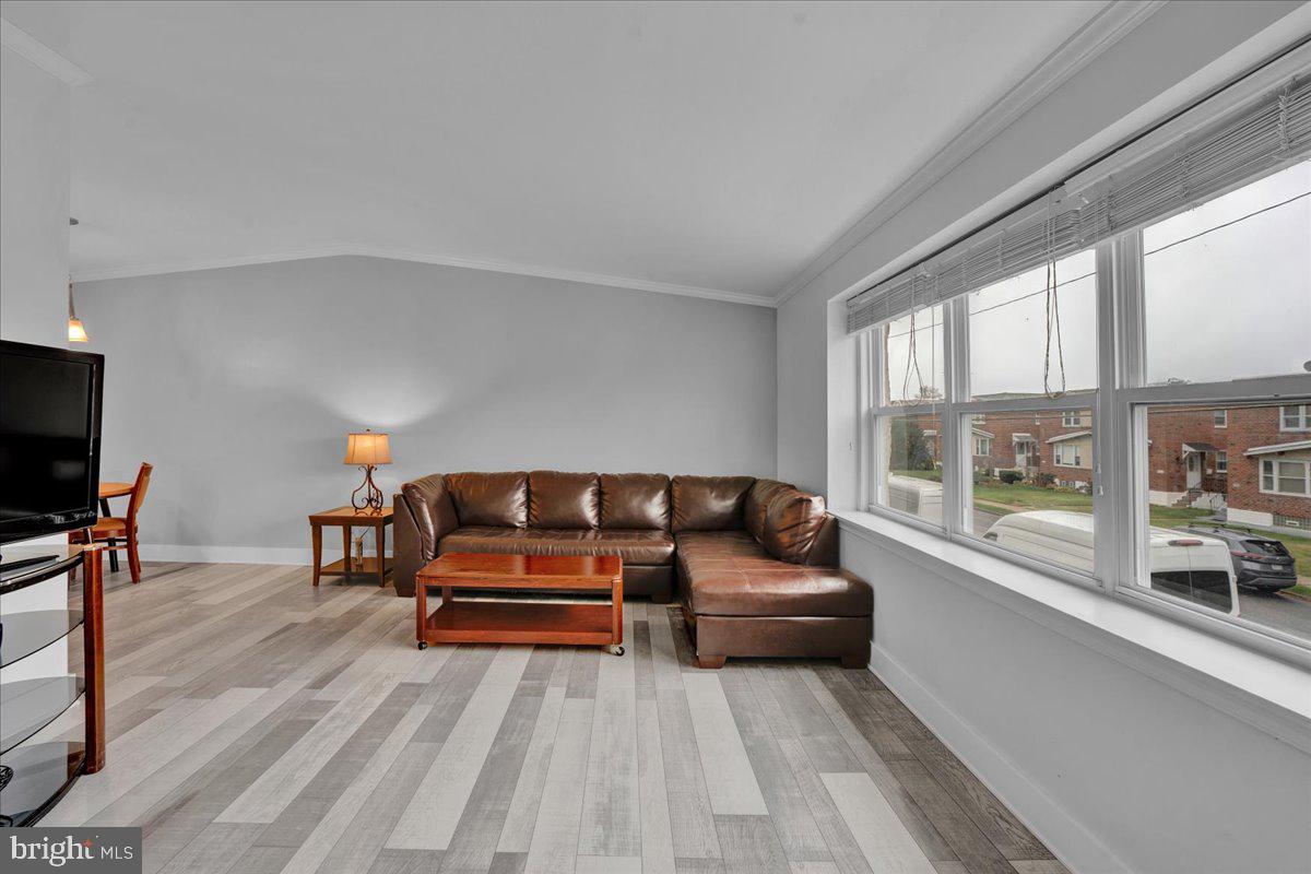 1952 Goodnaw Street, Unit 2 Philadelphia, PA 19115 - Photo 2 of 26 a living room with furniture and a flat screen tv