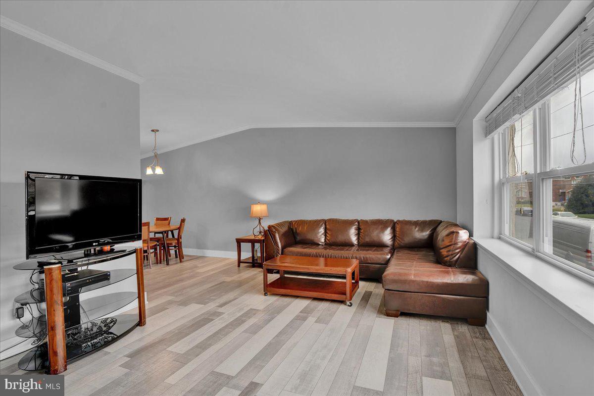 1952 Goodnaw Street, Unit 2 Philadelphia, PA 19115 - Photo 3 of 26 a living room with furniture and a flat screen tv