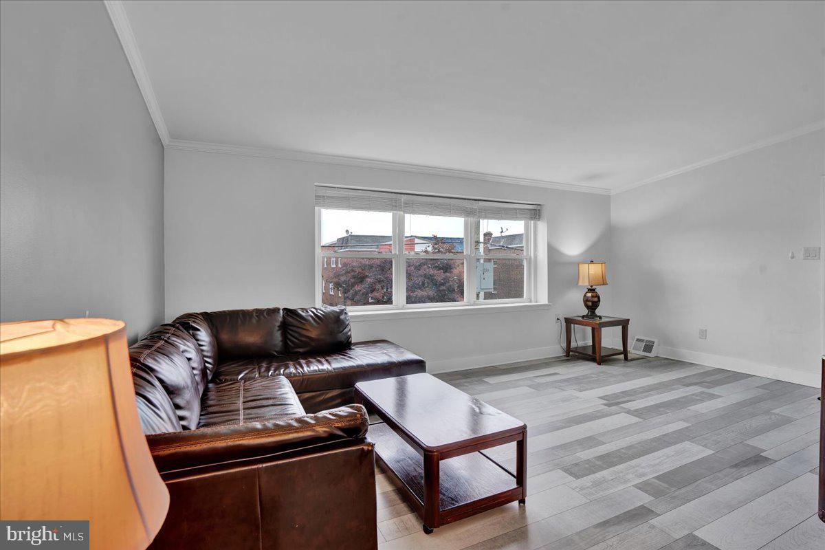 1952 Goodnaw Street, Unit 2 Philadelphia, PA 19115 - Photo 5 of 26 a living room with furniture and a window