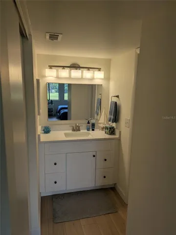 a white toilet sitting next to a bathroom sink