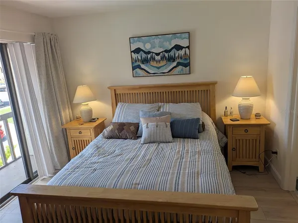 a bed room with a bed and a window