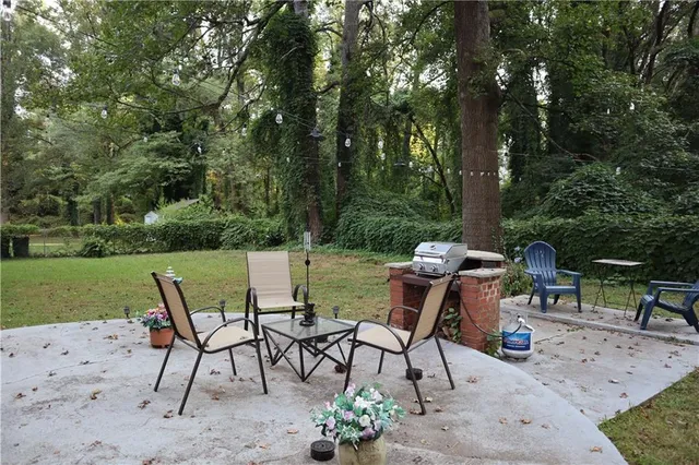 a view of a chairs and table in the yard
