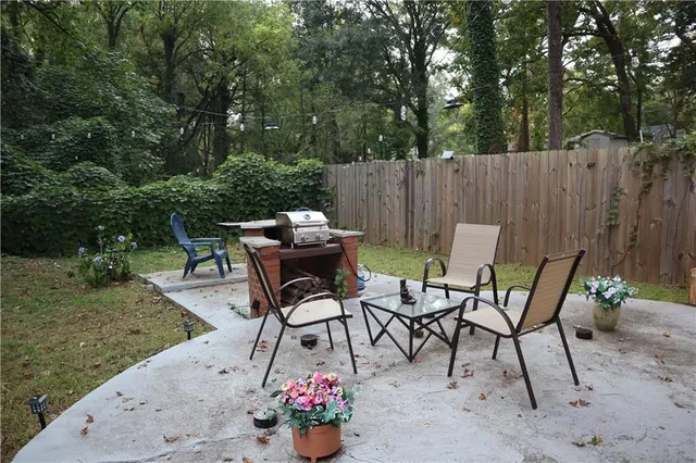 a view of a chairs and tables in the backyard
