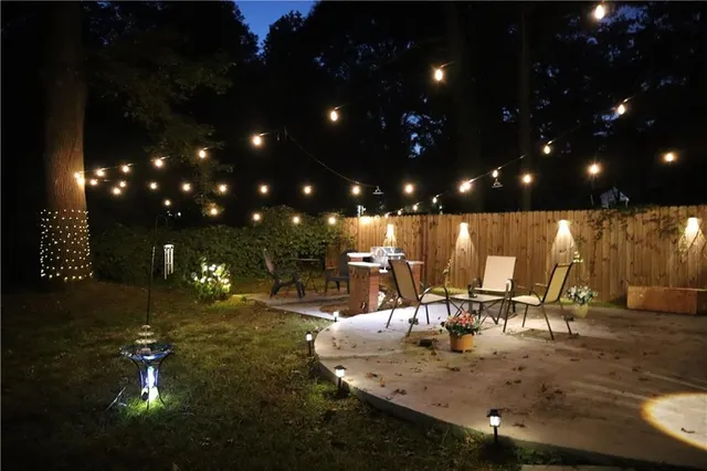 a view of a porch with dining table and chairs