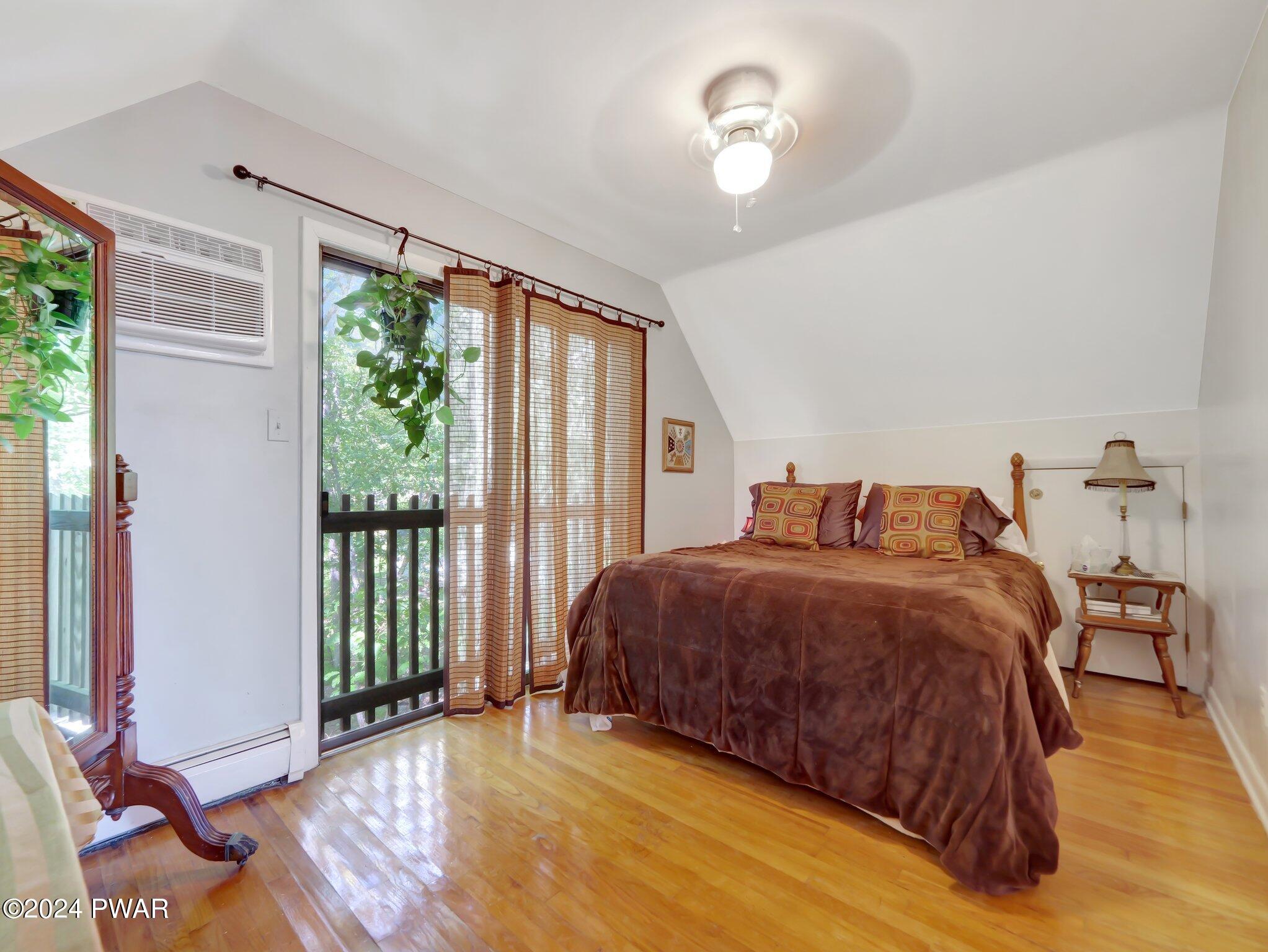 3178 Cherry Ridge Road Bushkill, PA 18324 - Photo 20 of 54 a spacious bedroom with a bed and a window