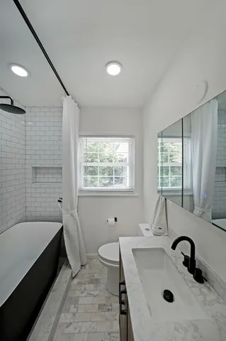 a bathroom with a sink and a bathtub