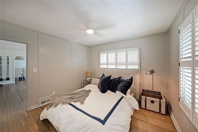 a bed room with a bed and a window