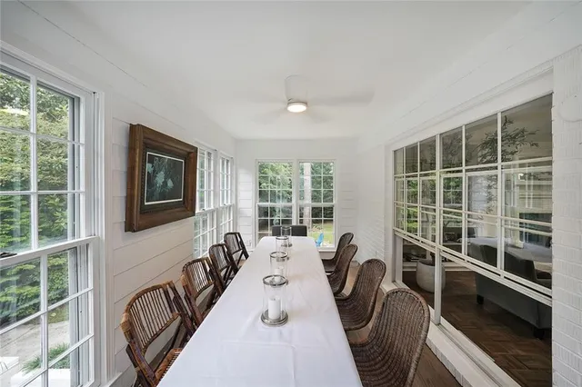 a view of a dining room with furniture window and outside view