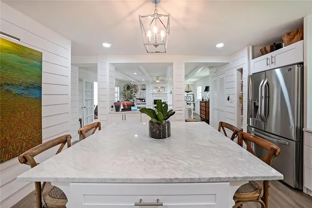 a kitchen with refrigerator and window