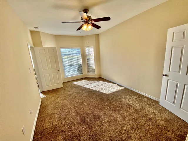 a view of livingroom with hardwood floor and a ceiling fan