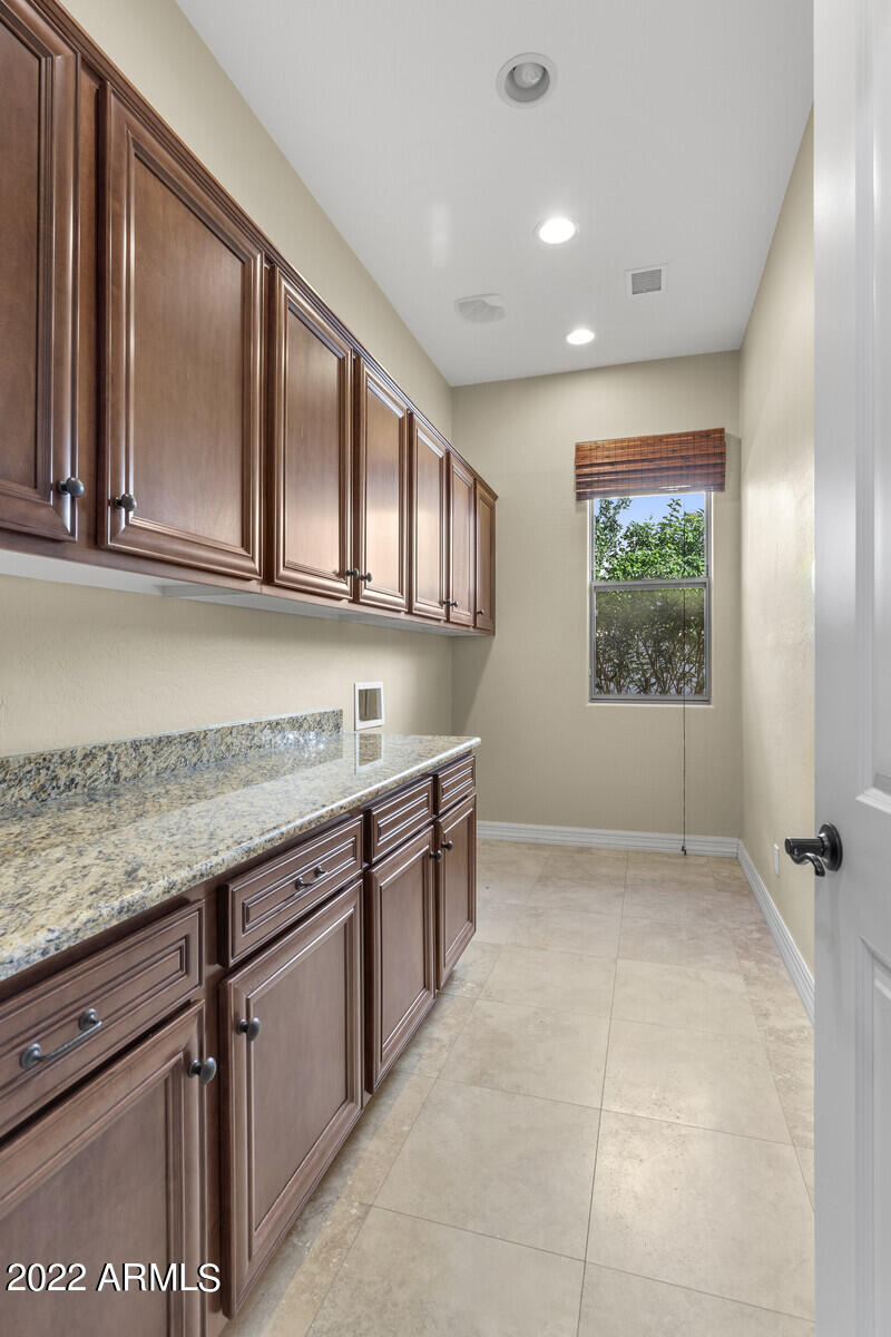 2810 East Blue Sage Road Gilbert, AZ 85297 - Photo 53 of 93 Inside laundry with cabinetry