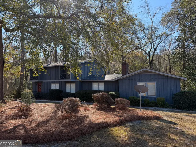 a backyard of a house with lots of green space