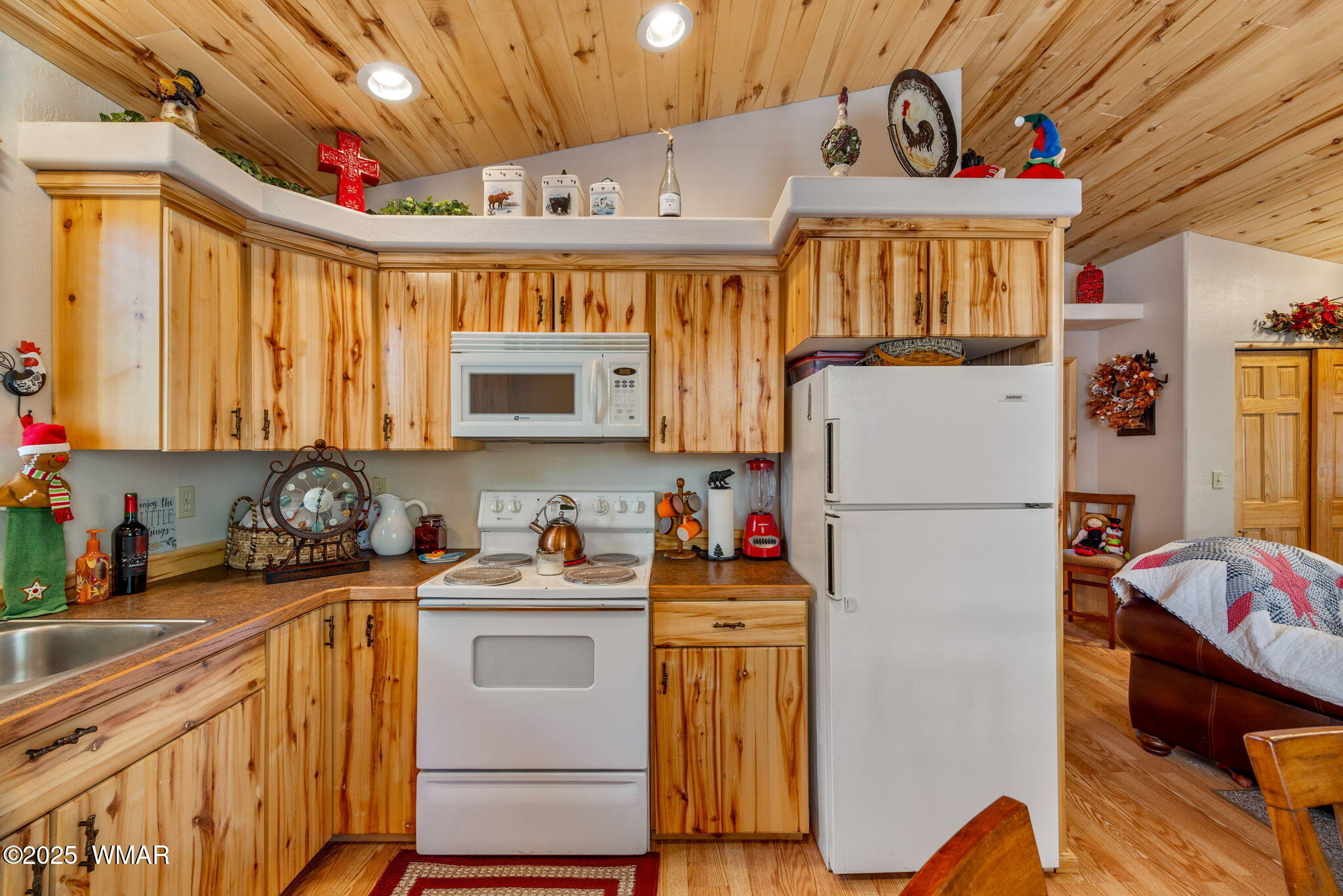 2979 Western Star Drive Overgaard, AZ 85933 - Photo 11 of 31 a kitchen with a refrigerator and a sink