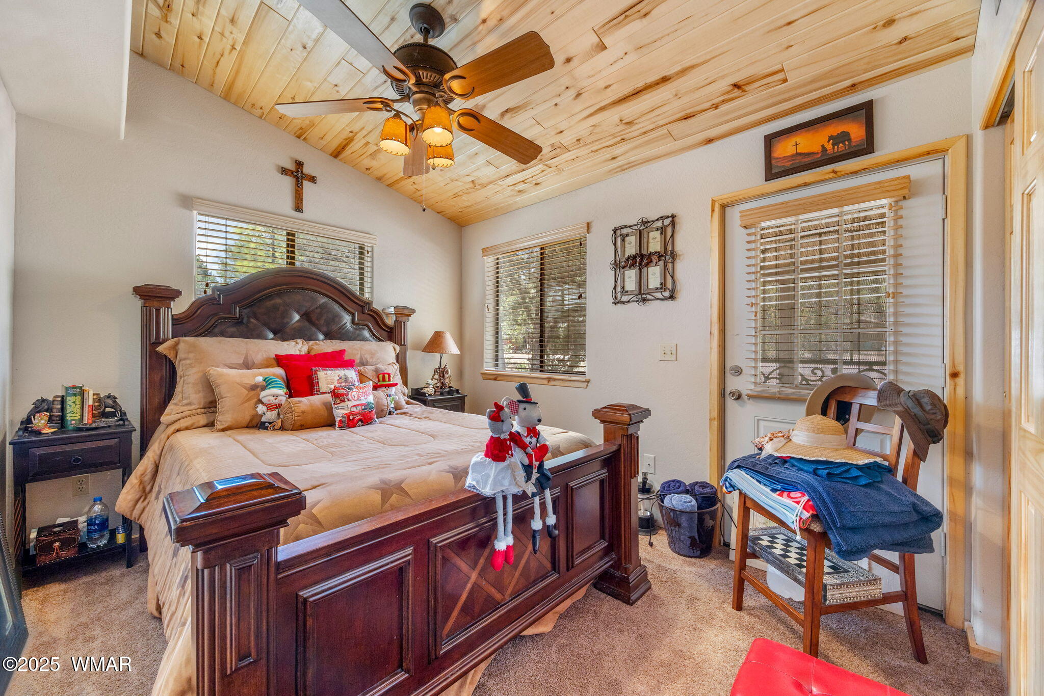 2979 Western Star Drive Overgaard, AZ 85933 - Photo 13 of 31 a bedroom with a bed and a chandelier