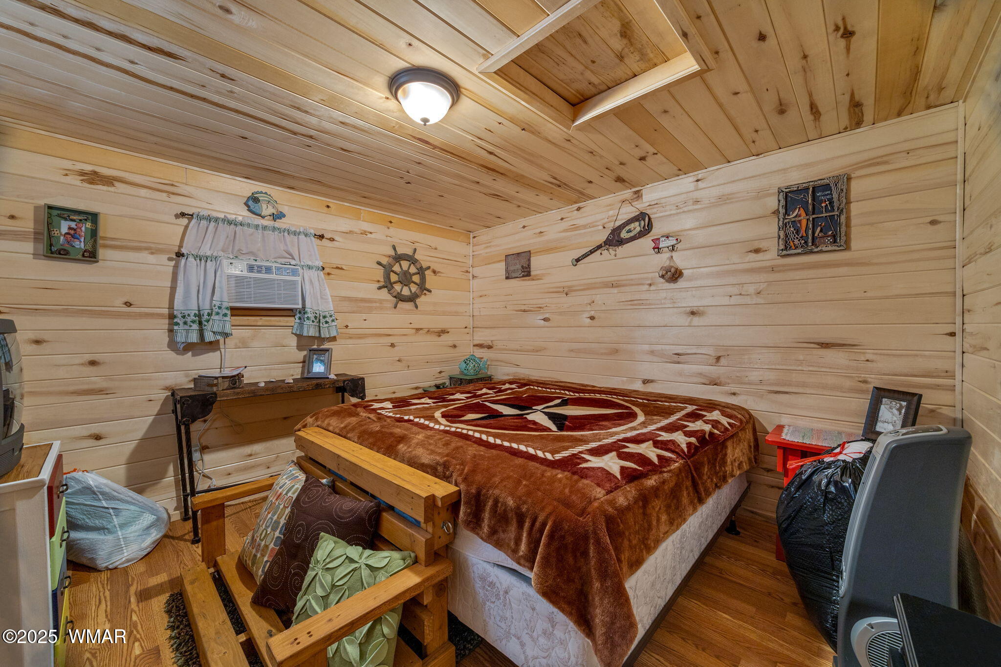 2979 Western Star Drive Overgaard, AZ 85933 - Photo 22 of 31 a bedroom with a bed and a table