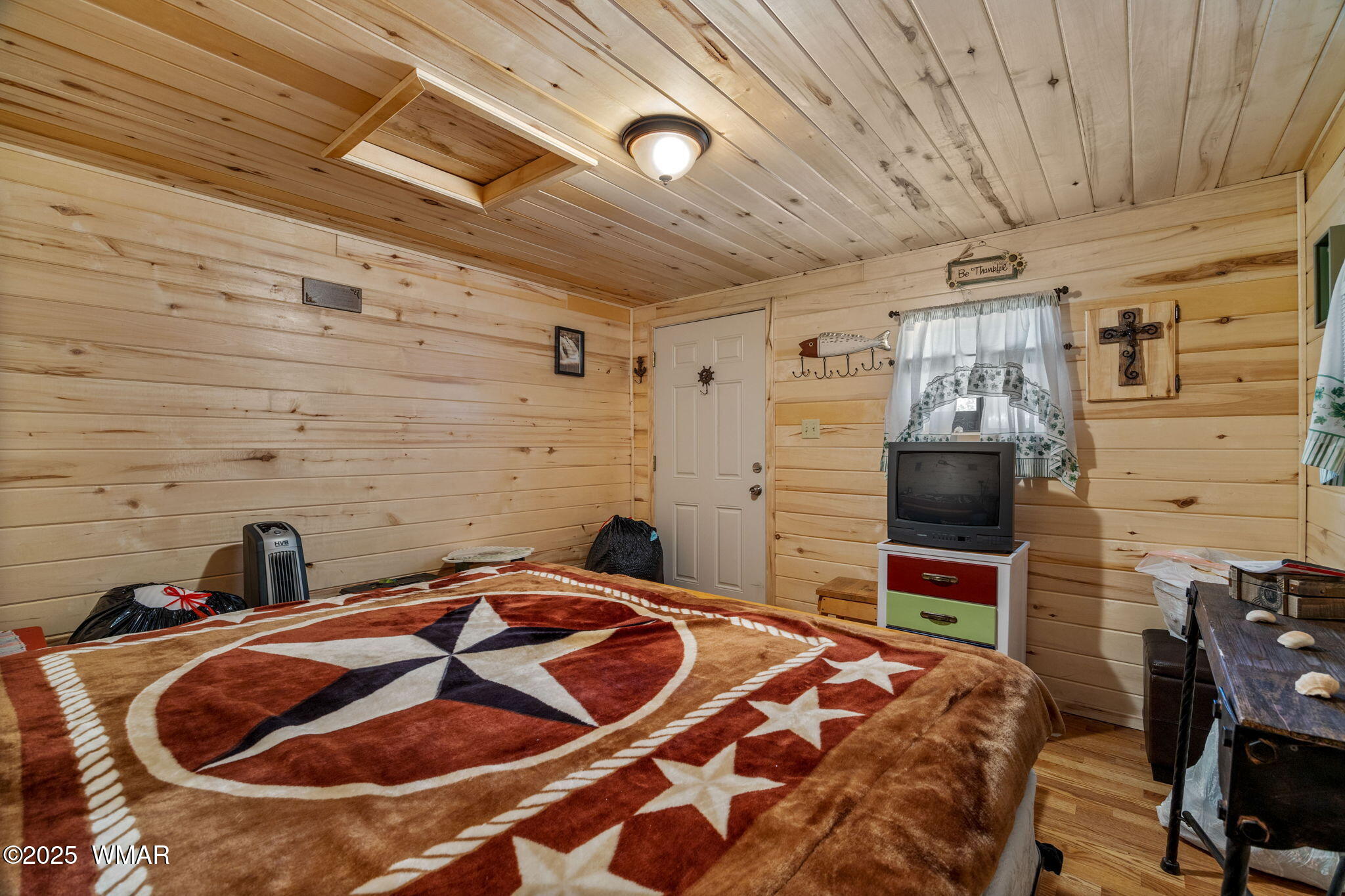 2979 Western Star Drive Overgaard, AZ 85933 - Photo 23 of 31 a bedroom with a bed and a flat screen tv