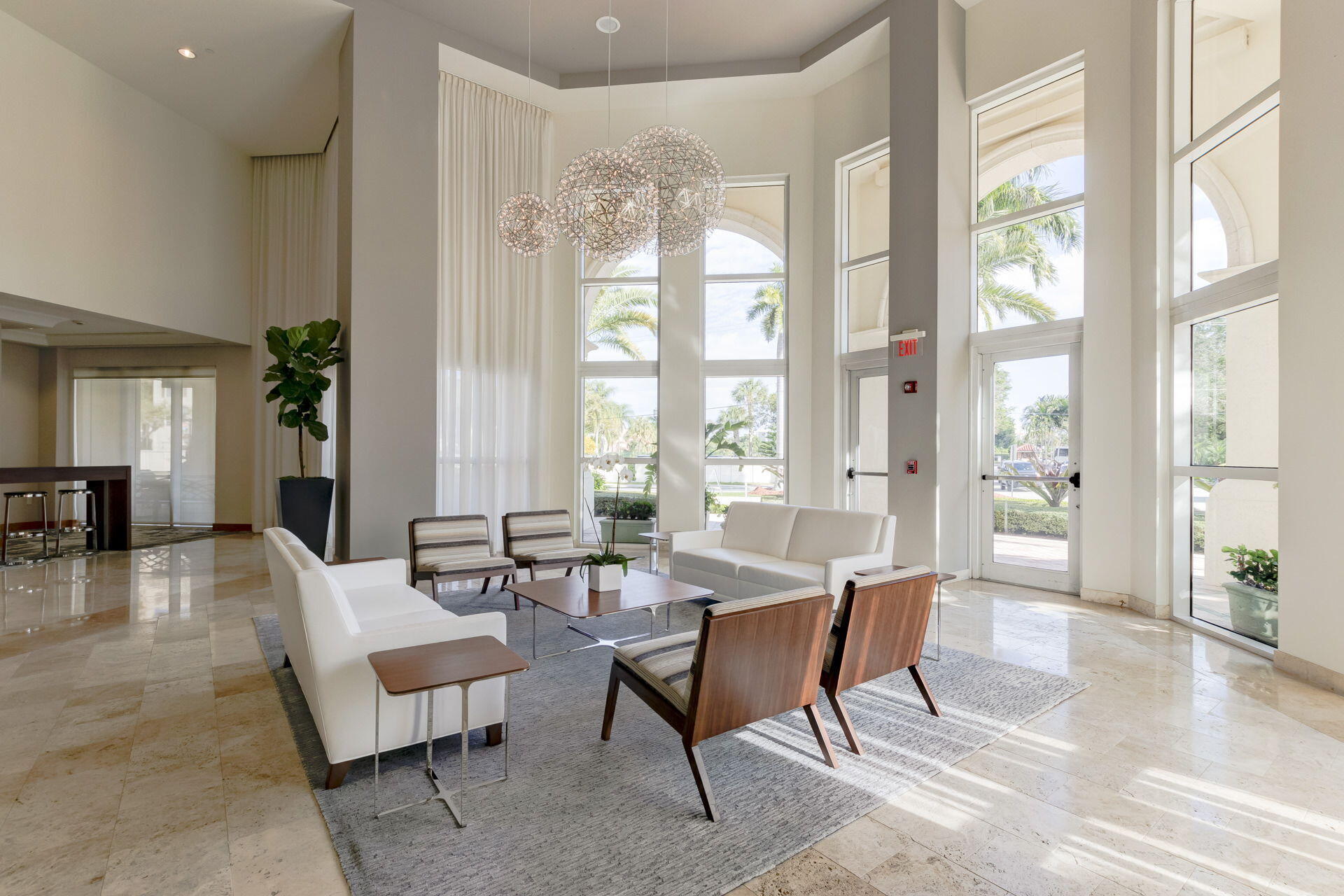 99 Southeast Mizner Boulevard, Unit 636 Boca Raton, FL 33432 - Photo 36 of 39 a living room with furniture and a large window