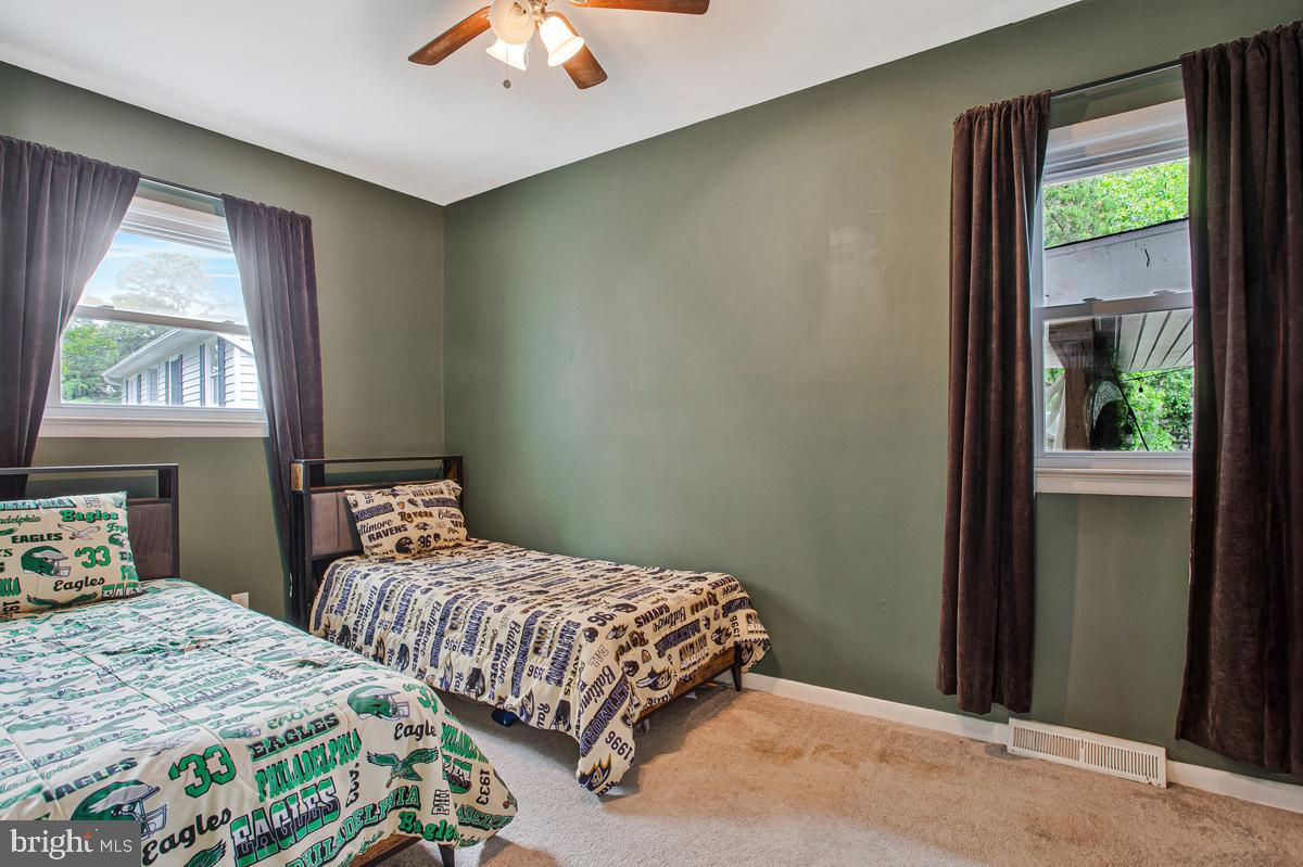976 Shore Acres Road Arnold, MD 21012 - Photo 26 of 40 a bedroom with two beds and a window