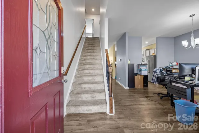 a view of a hallway with seating area
