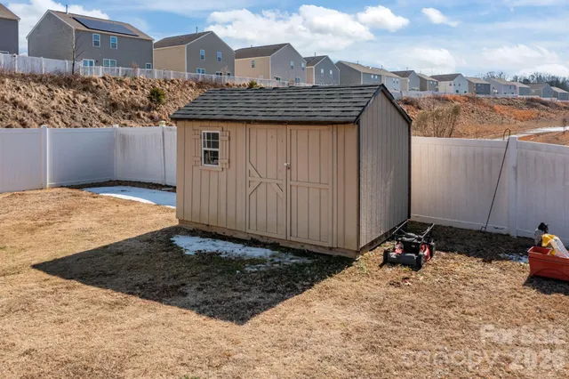 a view of a backyard of the house