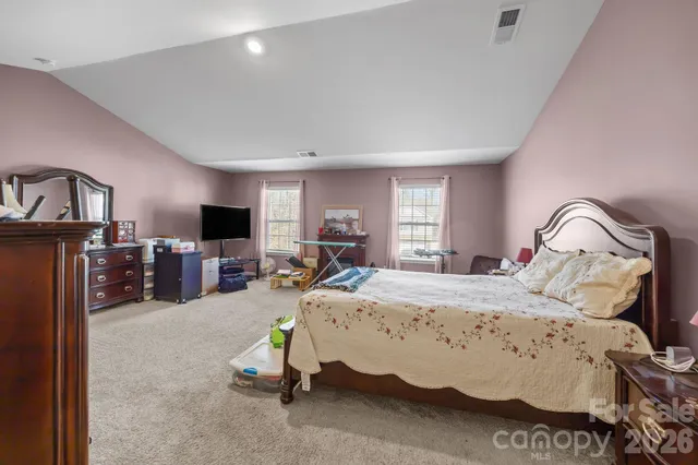 a bedroom with a bed and furniture