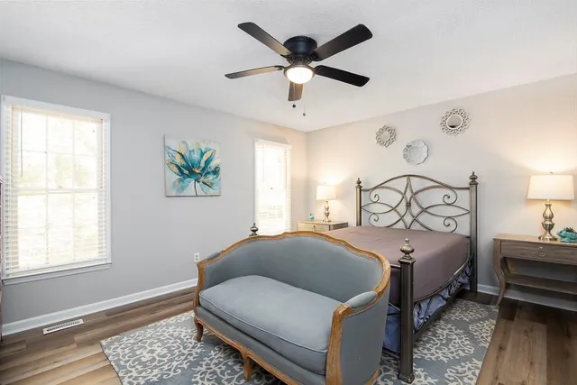 a bedroom with bed and window