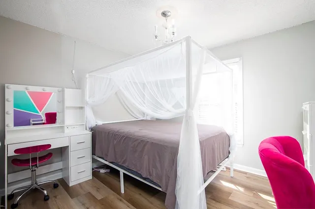 a bedroom with a bed and a couch