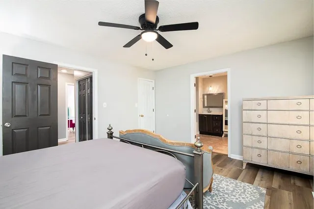 a bedroom with a bed and a dresser