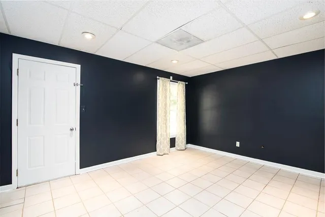 a bedroom with a bed and a night stand