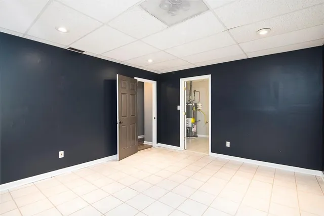 a bedroom with a bed and a night stand