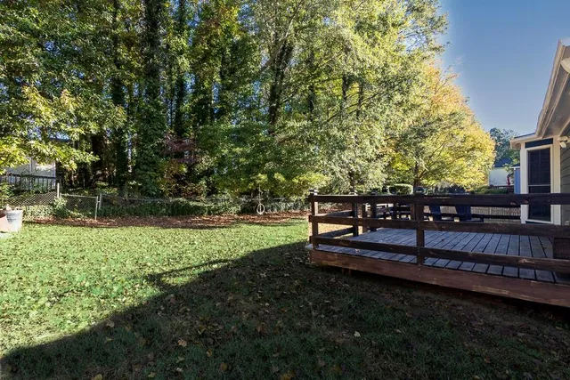 a view of a park with large trees