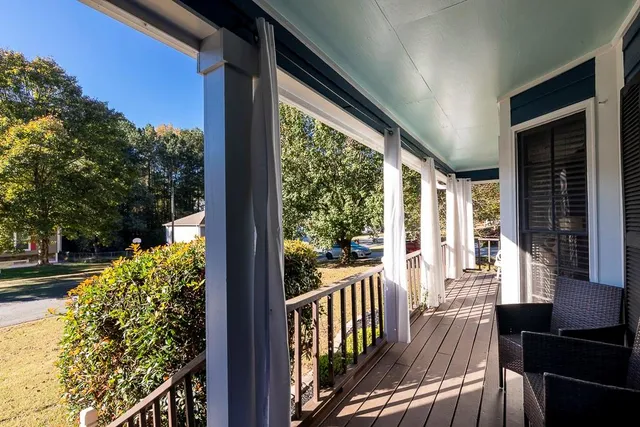 a view of balcony with wooden floor