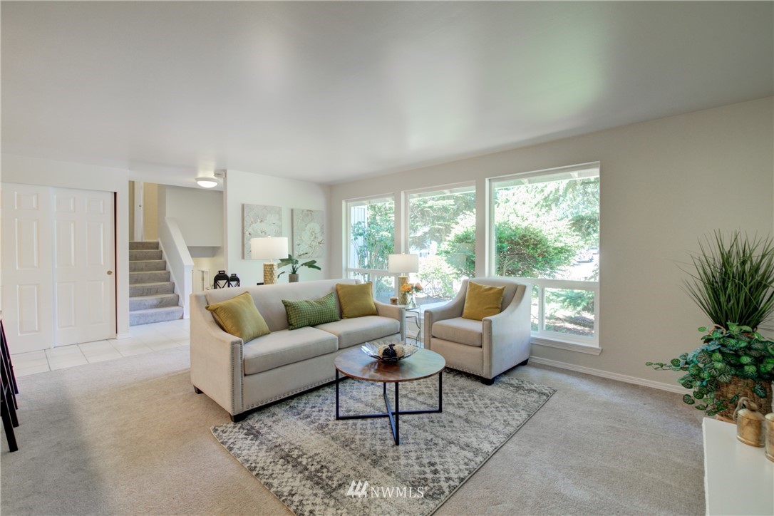 21930 3rd Place West Bothell, WA 98021 - Photo 11 of 34 a living room with furniture and a large window