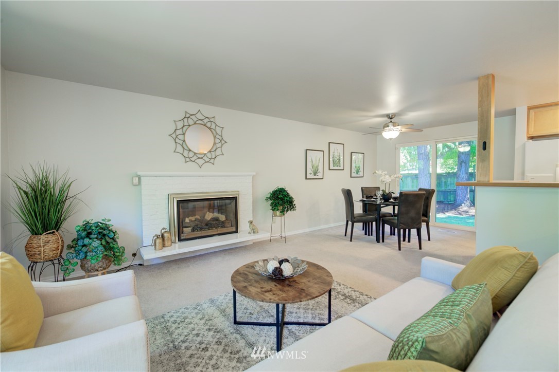 21930 3rd Place West Bothell, WA 98021 - Photo 12 of 34 a living room with furniture and a fireplace