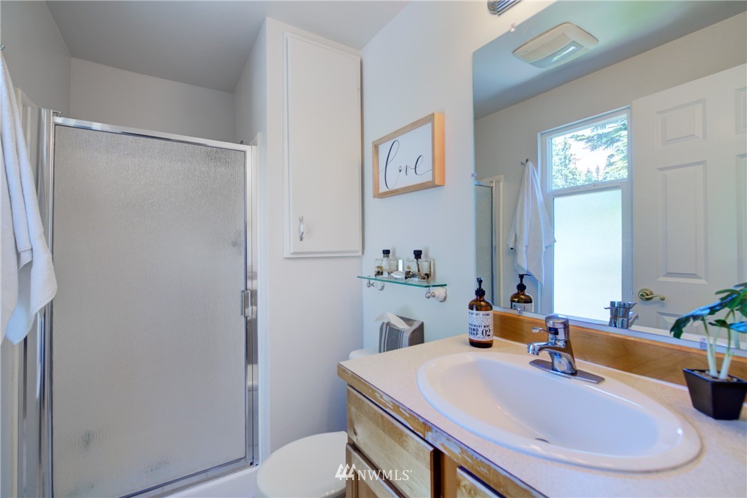 21930 3rd Place West Bothell, WA 98021 - Photo 17 of 34 a bathroom with a sink toilet and shower