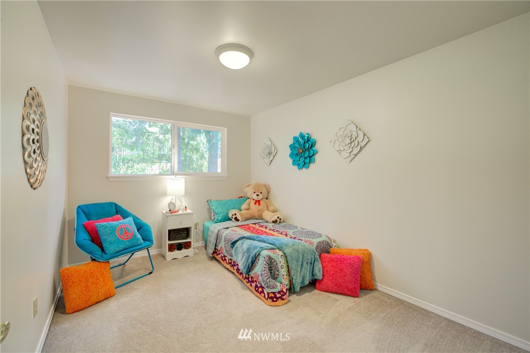 21930 3rd Place West Bothell, WA 98021 - Photo 19 of 34 a bedroom with a bed and a couch