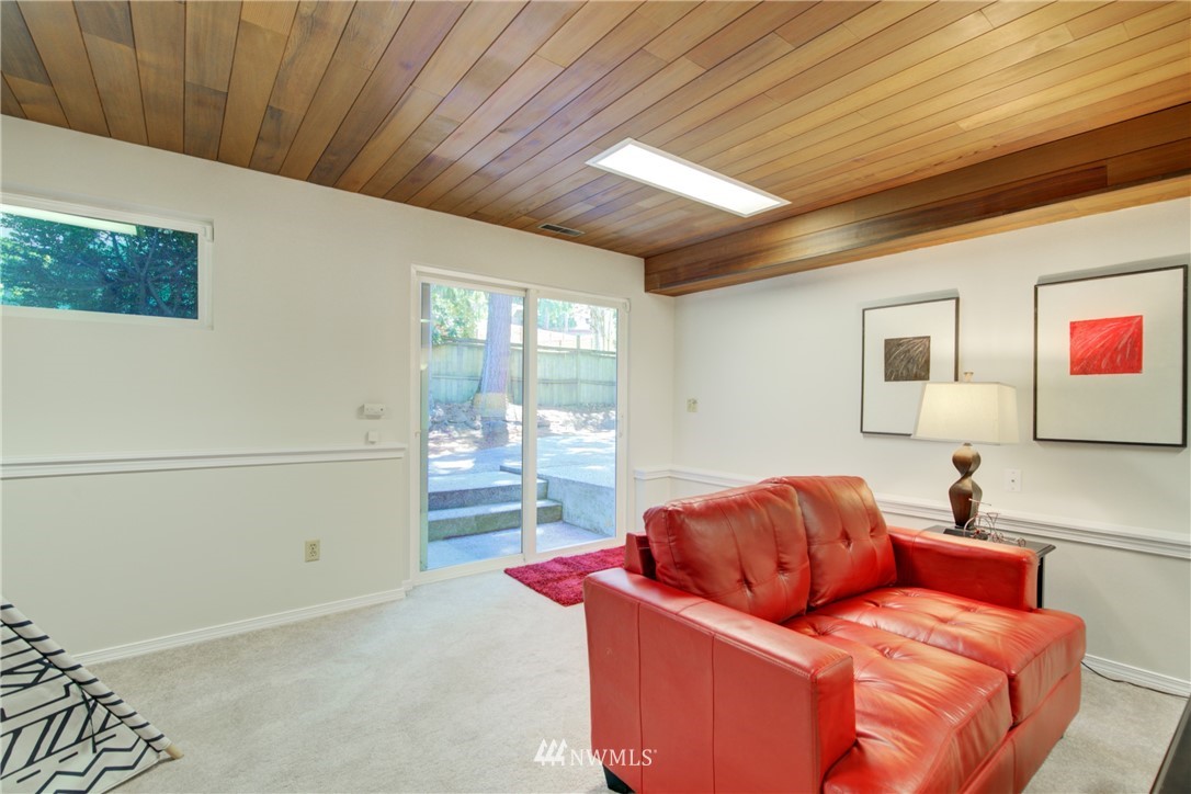 21930 3rd Place West Bothell, WA 98021 - Photo 22 of 34 a living room with furniture a ceiling fan and a window