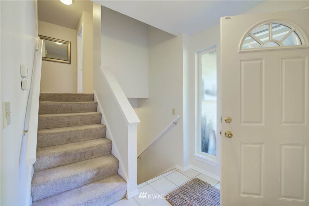 21930 3rd Place West Bothell, WA 98021 - Photo 23 of 34 a view of entryway with wooden floor and a front door