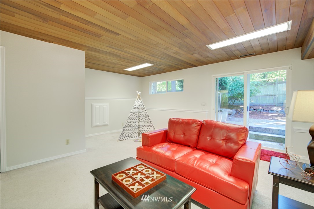 21930 3rd Place West Bothell, WA 98021 - Photo 24 of 34 a room with furniture and a rug