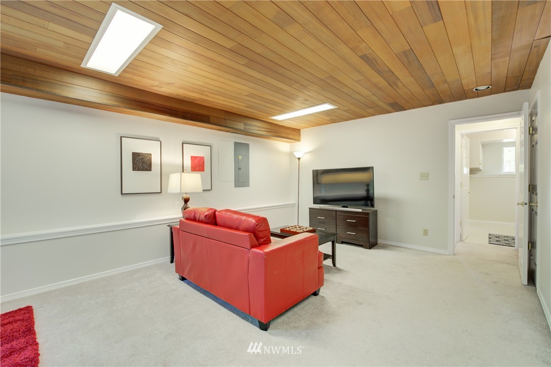 21930 3rd Place West Bothell, WA 98021 - Photo 25 of 34 a living room with furniture and a flat screen tv