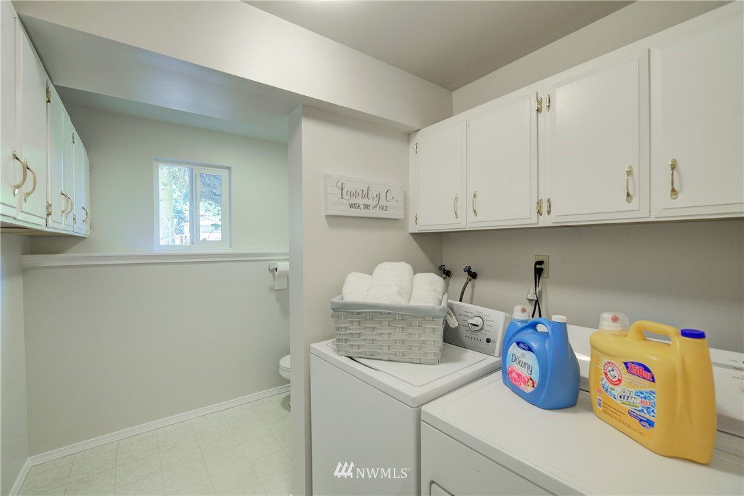 21930 3rd Place West Bothell, WA 98021 - Photo 26 of 34 a kitchen with a sink and cabinets